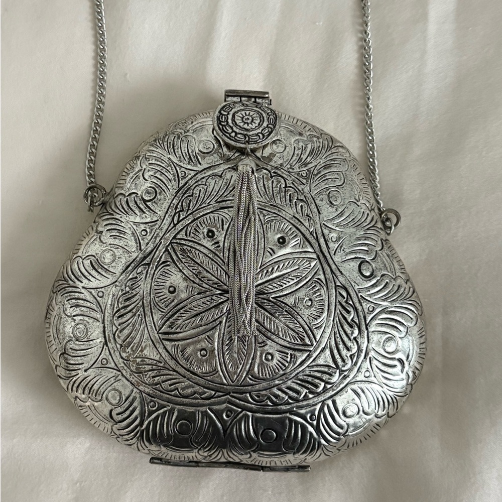 From St Xavier Silver Clutch